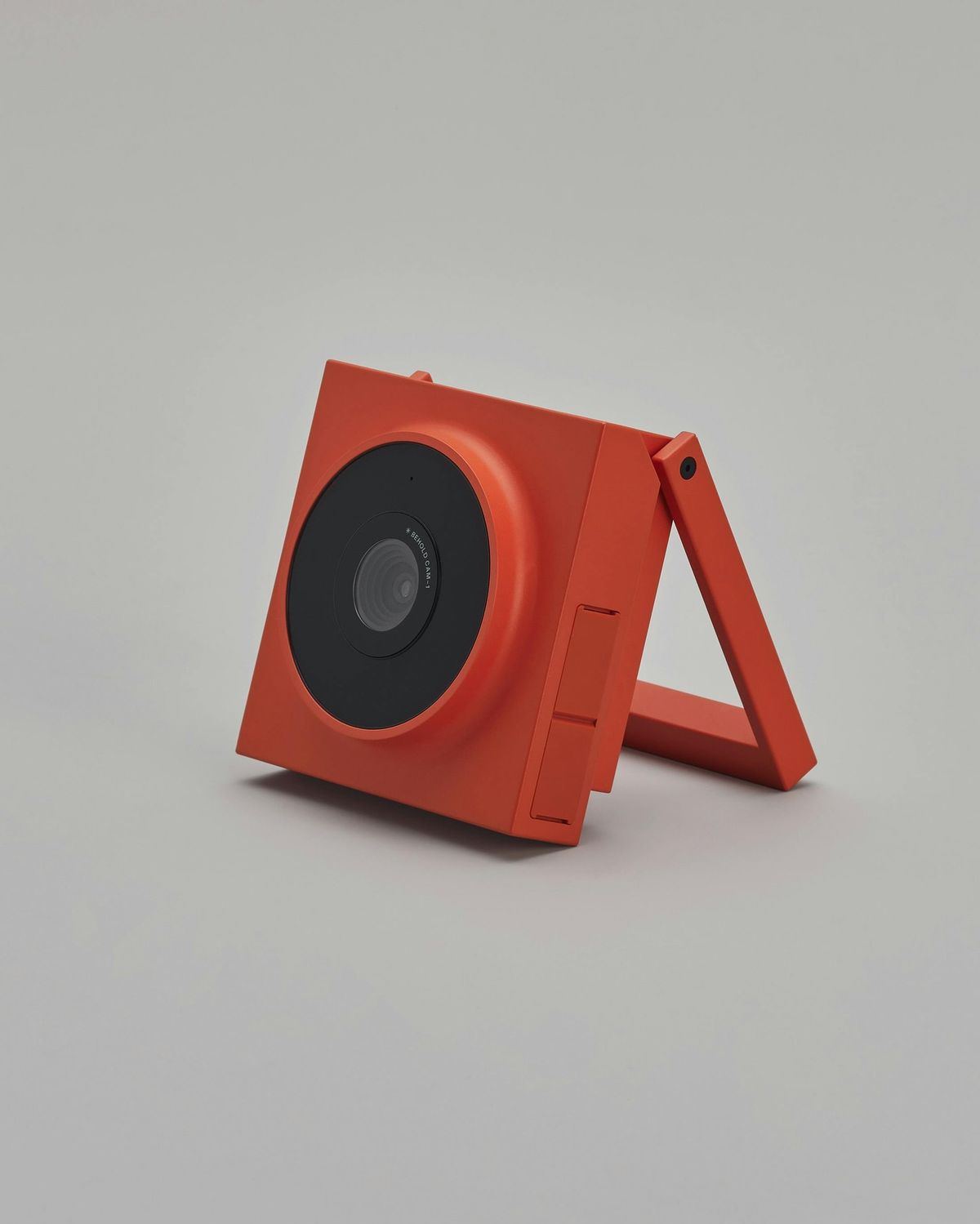 Portable camera standing on its folding handle