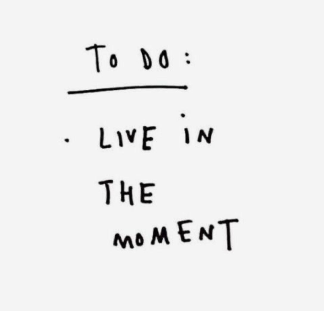 Handwritten to-do note reading "Live in the moment"